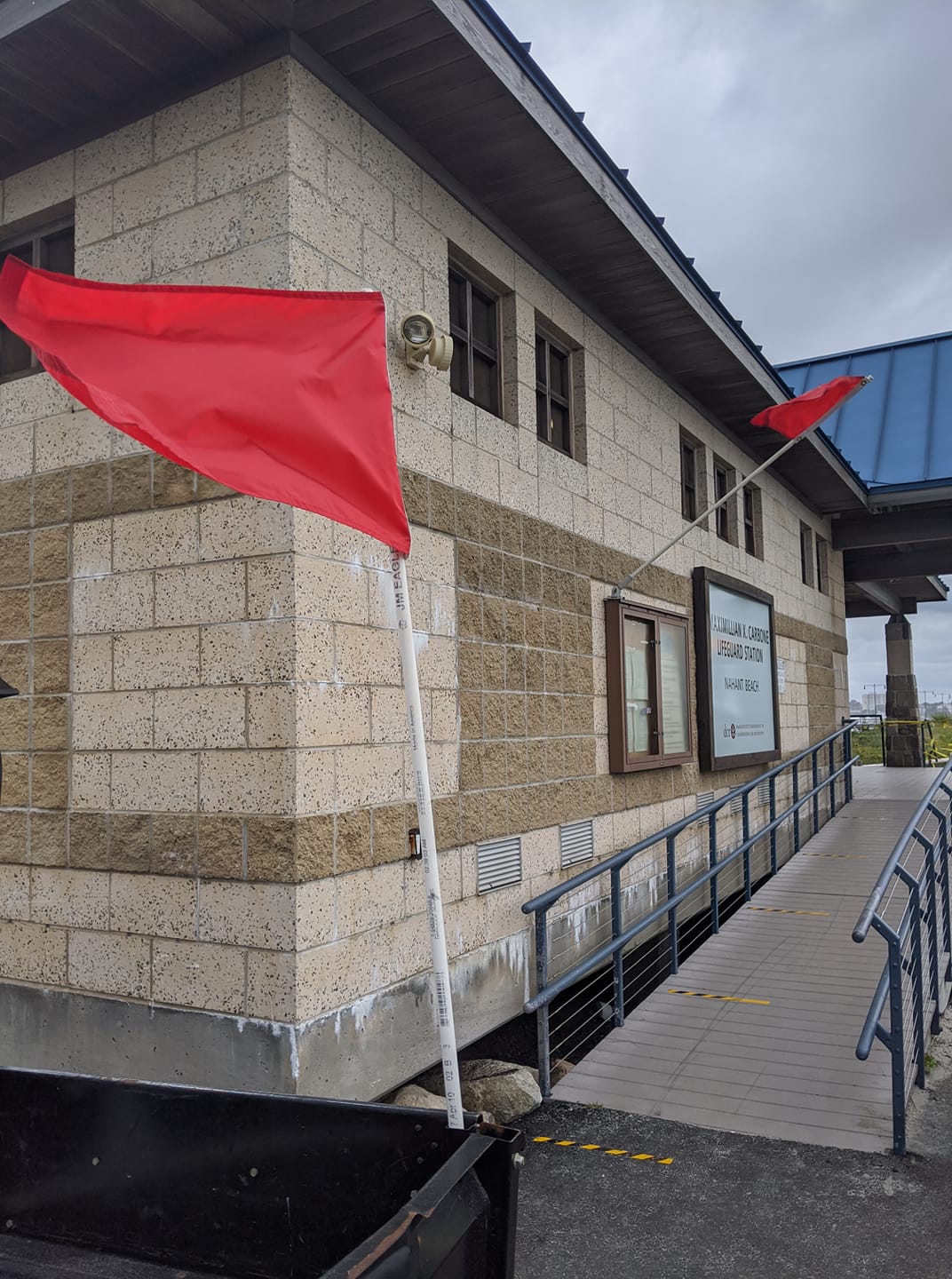 Lifeguard flag marking the designated surf zone at Nahant Beach